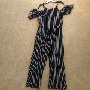 Black and white striped sleeveless jumpsuit.